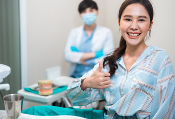 Fototapeta premium Healthcare and medicine concept.Happy asian woman look at camera and visiting a dentist office .