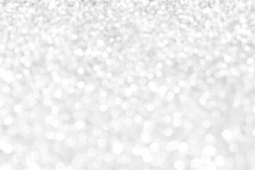 White and gray bokeh background. Photo can be used for the concepts of New Year, Christmas, Wedding Anniversary and all celebrations.