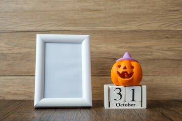 Orange pumpkin, 31 October calendar and frame with copy space for text. Happy Halloween day, Hello October, fall autumn season, Festive, party and holiday concept
