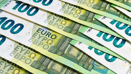 Fototapeta na wymiar Background of cash Euro notes. View of 100 euro bills. Economics and finance. Cash banknotes. The single currency of the European Union.