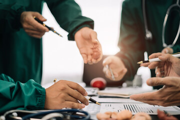 Medical team working on digital tablet healthcare doctor technology tablet using computer analyzed the results of medical reports, an online conference at the hospital.
