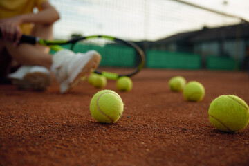 Rest after game shot with focus on balls scattered across playing field