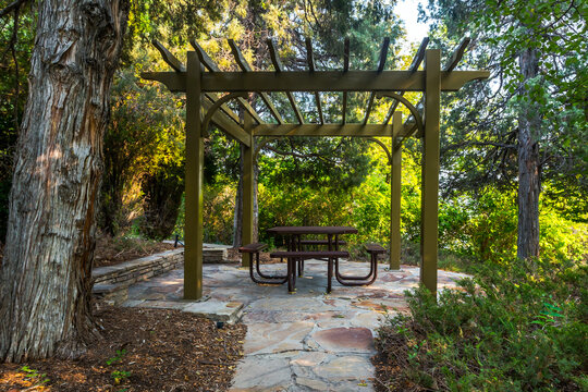Picnic table and chairs in garden velarium