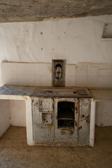 Arguedas caves interior kitchen details with oven and white walls, in Spain