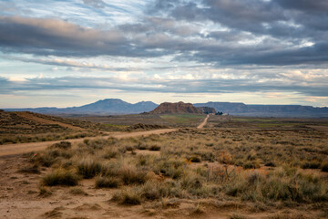 Fototapeta na wymiar Bardenas Reales desert landscape scenic view with road, in Spain