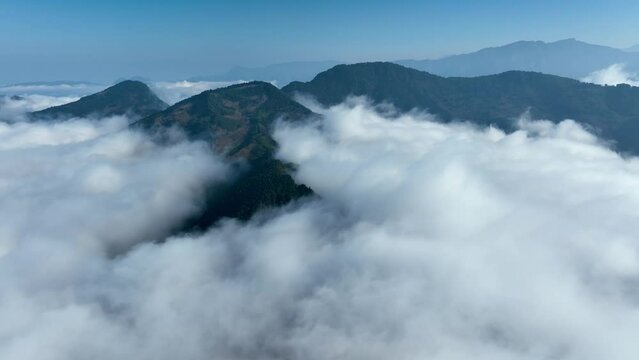 Aerial shot of low clouds moving pass mountains in Taiwan