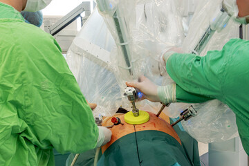 Minimally invasive surgical interventions are performed to remove the tumor. Detail of a surgical...