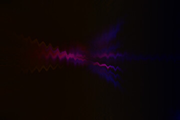 Unidentified wavy object like octopus on black background