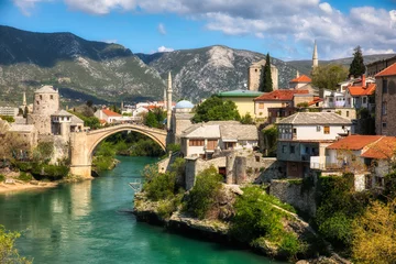 Papier Peint photo Stari Most The Famous Old Bridge (Stari Most) Crossing the River Neretva in Mostar, Bosnia and Herzegovina