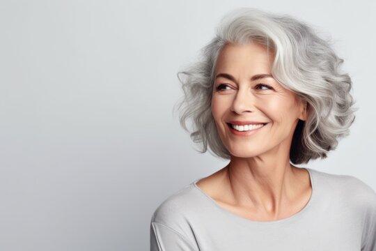 Beautiful elderly woman with gray hair smiling