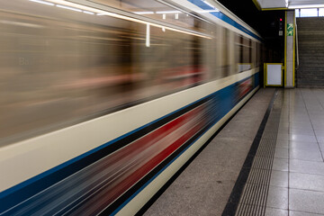 Train speeding through a station