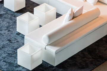 Cube and cylinder shaped sofas and tables