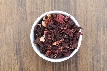 Dried Hibiscus flowers in a bowl top view 