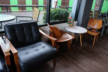 Luxury leather sofa wood arm in vintage cafe