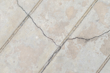 Fototapeta premium cement surface cracks on the pavement were affected by the earthquake.