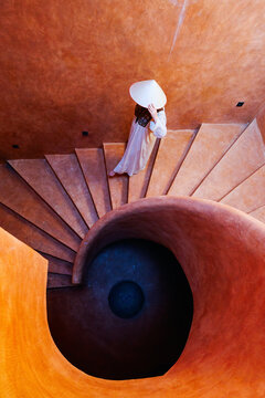 Woman walking down staircase