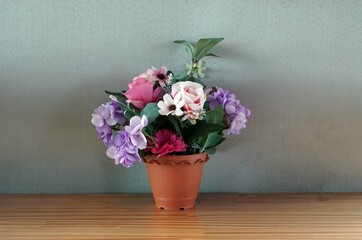 A flowers in a vase on a wooden table in the cafe, decoration concept.