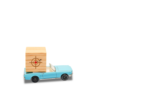 Model car with wooden blocks on top. isolated on white background. The concept of traveling towards goal. PNG