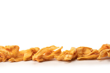 Dried melon slices isolated on a white background.