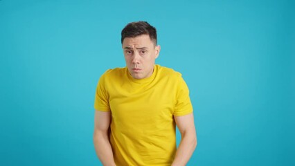 An insecure casual man looking all around