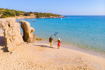 Voulisma Beach Istron Crete Greece, the most beautiful beaches of Crete island Istron Bay near Agios Nikolaos. A young couple on vacation in Greece Crete 