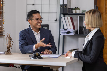 Business Asian people and lawyers, Businessman and lawyer discuss the contract document. Judge gavel deciding on marriage divorce signing papers. lawyer concept.