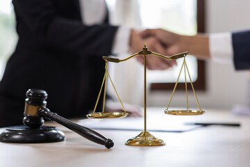 Close up of photo lawyer male notary working in a courtroom on wooden table office, Legal law, advice deal justice and law concept.	