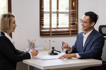 Business Asian people and lawyers, Businessman and lawyer discuss the contract document. Judge...