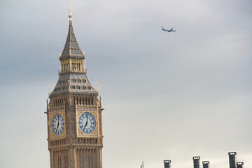 Beautiful Low Angle View of Historical Big Ben Clock Tower from river Thames and London Eye,...