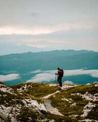 Fototapeta premium person on the top of the mountain