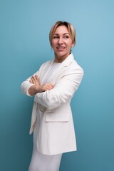 confident young european woman in white jacket and dress