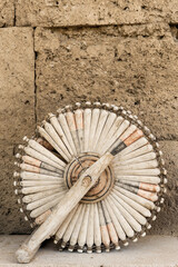 Sultanhani, Turkey – May 22, 2012 :  Spinning wheel, Sultanhani caravanserai on the former silk road, Sultanhani, Antolia, Turkey