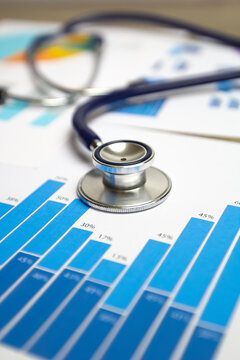Stethoscope on chart graph. The concept of medical statistics and analytical data.