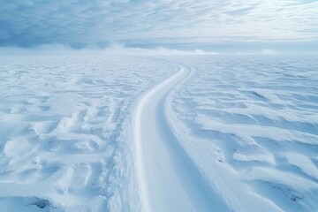 Aerial drone view de una carretera nevada en mitad de la nada - obrazy, fototapety, plakaty
