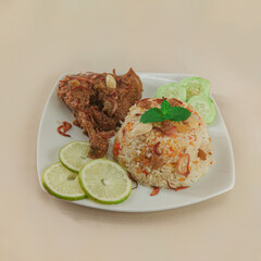 A traditional rice dish Pilaf or pilau is homemade and decorated with chicken roast..