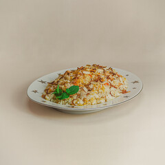 A traditional rice dish Pilaf or pilau is homemade and decorated with chicken roast..