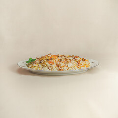 A traditional rice dish Pilaf or pilau is homemade and decorated with chicken roast..