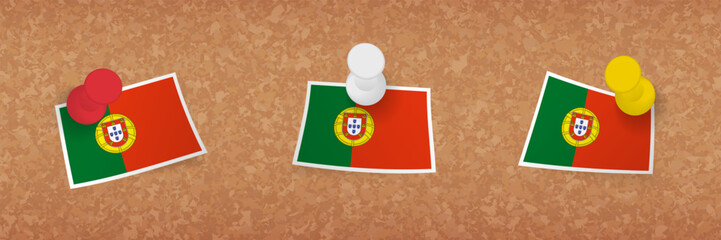 Portugal flag pinned in cork board, three versions of Portugal flag.