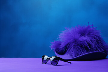 Elegant female hat with feathers and sun glasses on purple background. Bold and dramatic colors, fashion concept. Generative AI.