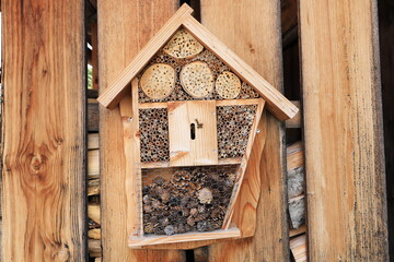 an insect hotel on a wall