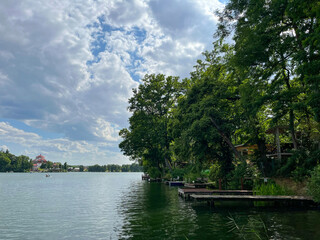 Beautiful landscape. Lake. Poland, Lubniewice. Trees, driftwood, reflection. Bridges for fishing.