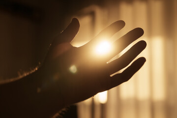 Abstract man hand playing with sunset light indoor © GCapture