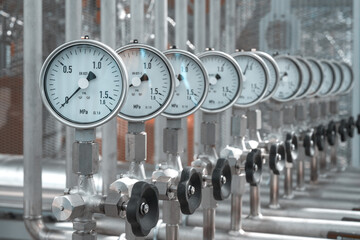 Stainless steel installation. Group of manometers instaled on pipeline in petrochemical technology