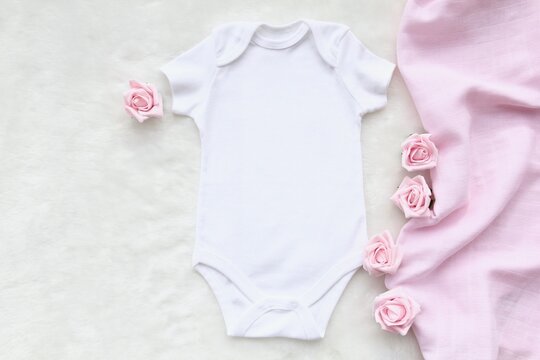 Layout Flat Lay White Baby Shirt Bodysuit, On A Pink Accessory , For Girls. Mock Up For Design And Placement Of Logos, Advertisements