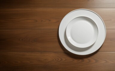white plate seen from above on wooden table
