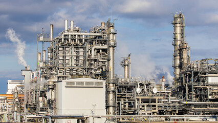 Industrial facility at a refinery with smokestacks for fuel production