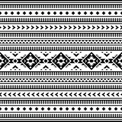 Geometric seamless pattern with Aztec tribal motives in black and white colors. Abstract background with ethnic style design for textile and decorative.