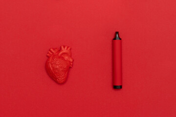 Red heart and electronic cigarette vape on red background. Horizontal medical theme poster,...