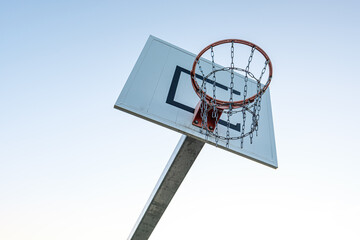 Basketball hoop in the white sky