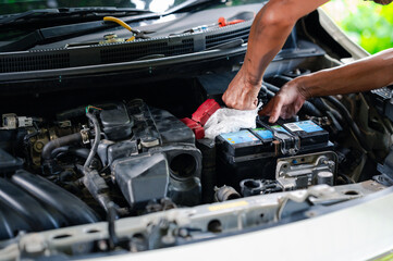 professional engineer, a man person fix, repair, and maintenance the battery of the car